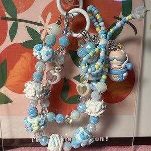 Skullpanda white and blue beaded keychain